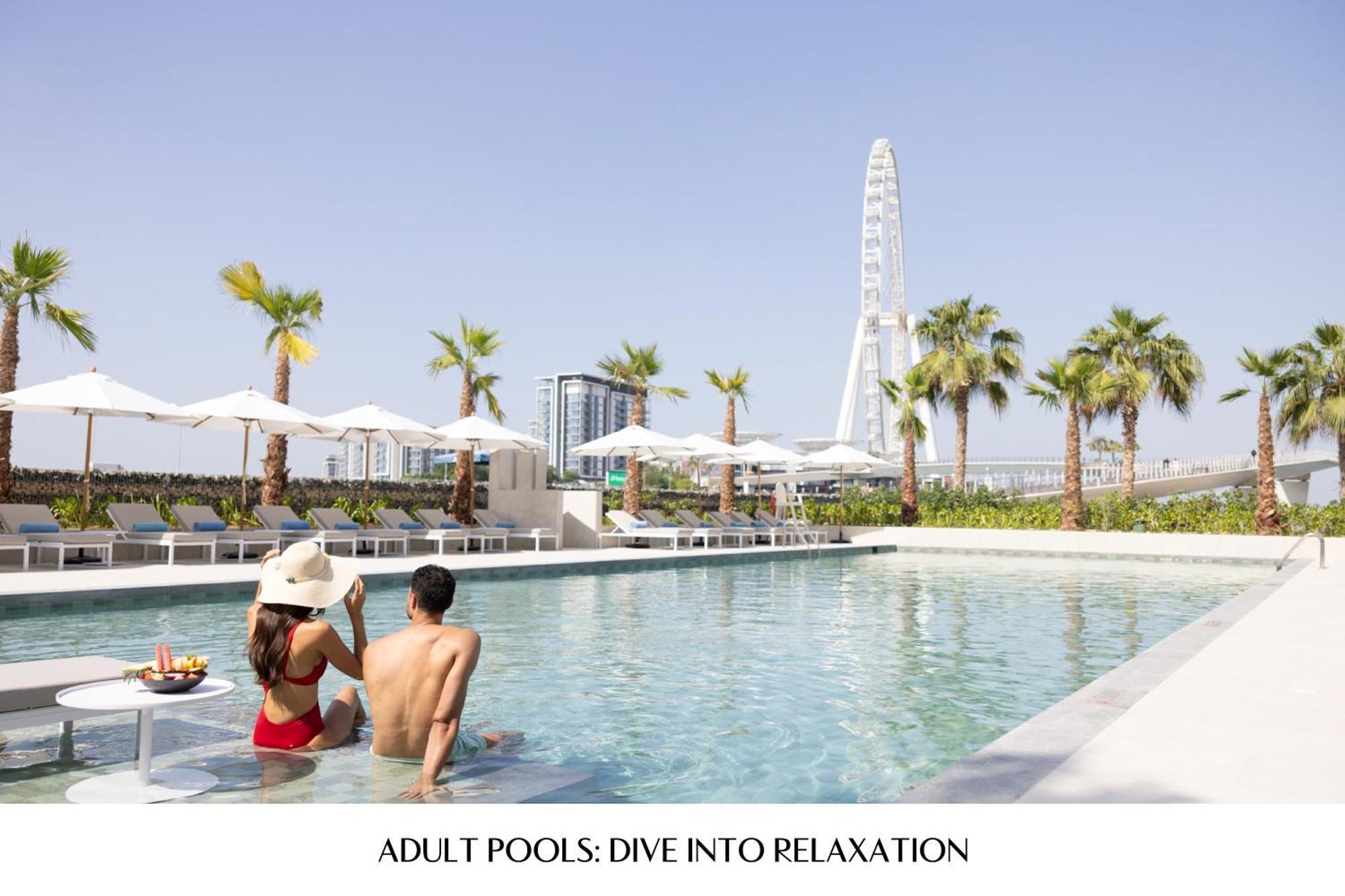 Address Beach Resort Dubai Esterno foto The swimming pool at the Address
